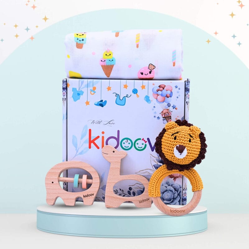 Hello World Baby Gift Set 2 front view with bear crochet rattle, giraffe and elephant wooden teethers, and swaddle